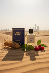 Luxury Dawha perfume bottle and box with raspberries and vetiver roots on Dubai desert sand