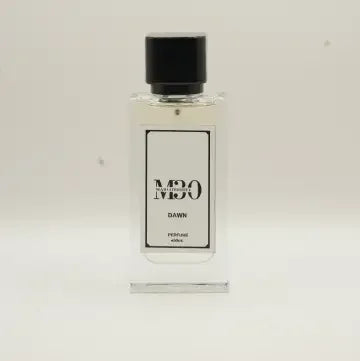 Clear glass perfume bottle labeled Dawn with black cap on a plain light background
