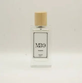 Clear glass perfume bottle with wooden cap labeled 'Desert' against light background