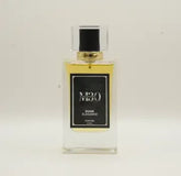 Elegant clear glass perfume bottle labeled Dusk Elegance against a plain background
